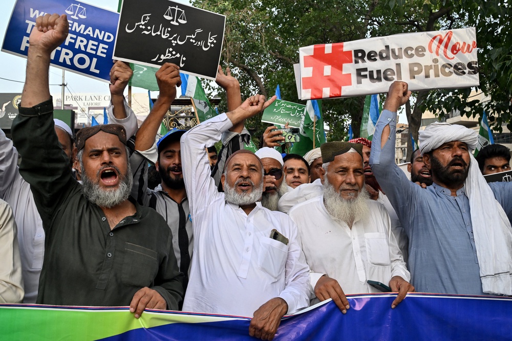 Supporters and members of the Jamaat-e-Islami party shout slogans during a protest against rising fuel prices triggered by the Middle East war, in Lahore (AFP/Getty)