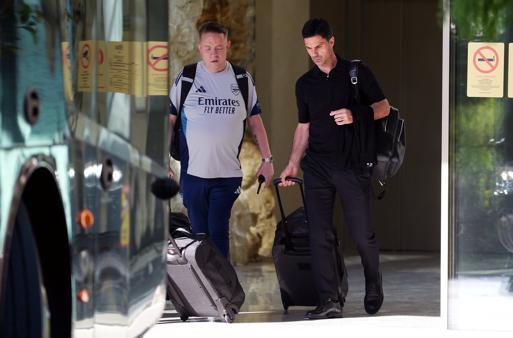 Arsenal manager Mikel Arteta (right) leaving the team hotel in Budapest (PA Wire)