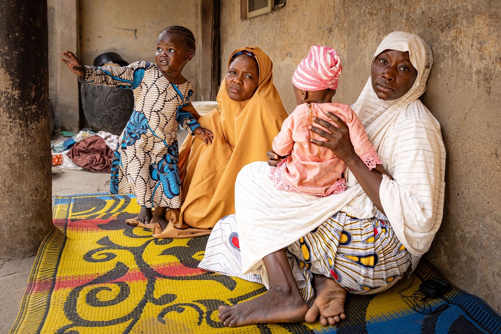 Zaiyatu (right), a 24-year-old mother of three, says her son was kidnapped in 2024 by criminal gangs in northern Nigeria and is still missing (Bel Trew/The Independent)