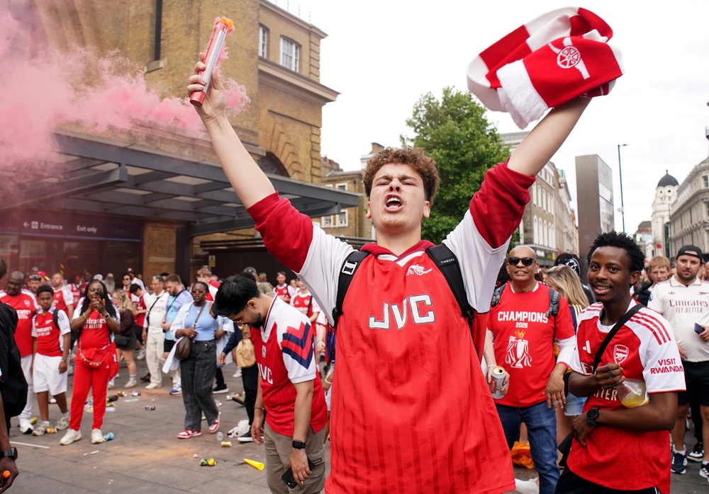 Arsenal fans outside King’s Cross Station following the parade (Gareth Fuller/PA) (PA Wire)