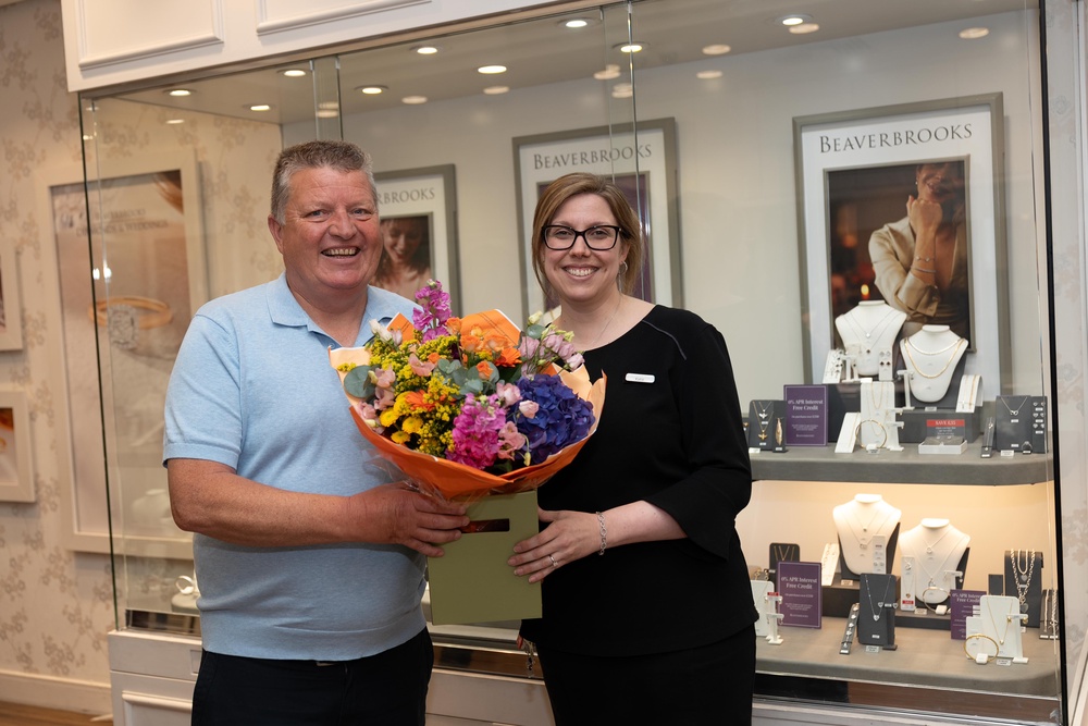 Lottery winner Gary MacDonald with Katie Feeney of Beaverbrooks in Lakeside Shopping Centre. (National Lottery/ PA)