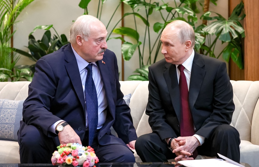 Russian president Vladimir Putin (R) talks to Belarus' president Alexander Lukashenko during the Supreme Eurasian Economic Council of the Eurasian Economic Union in Astana (AFP/Getty)