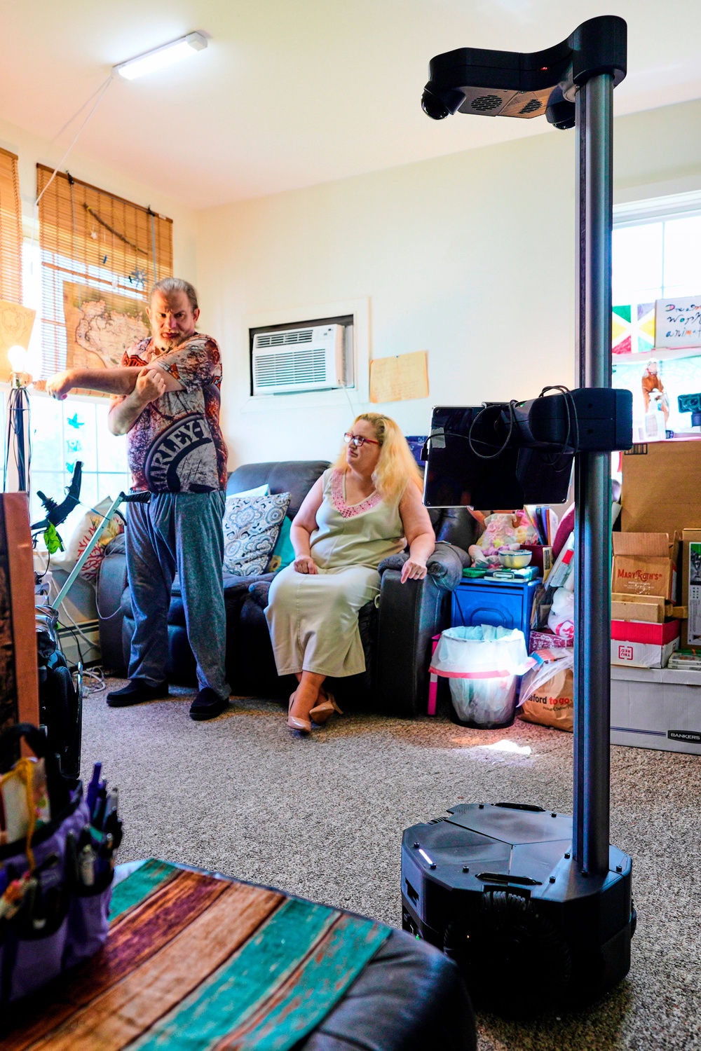 A Hello Robot gives audio and visual guidance for Brian Marquis' daily exercise routine as he recovers from a brain injury (Copyright 2026 The Associated Press. All rights reserved)