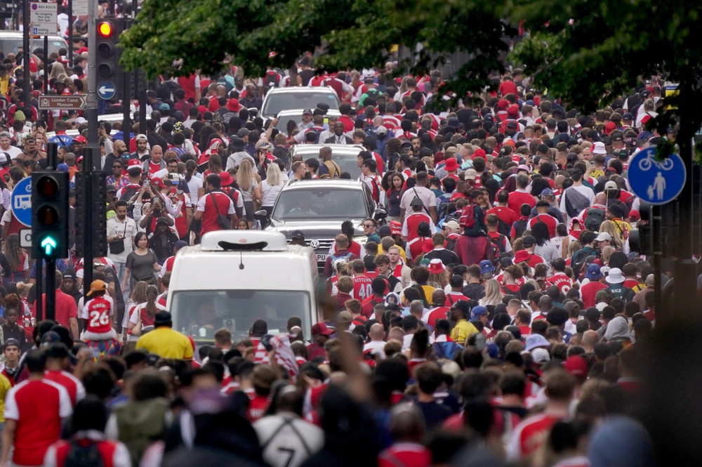 Arsenal fans made their way towards King’s Cross station following a victory parade to celebrate their club winning the Premier League title (PA)