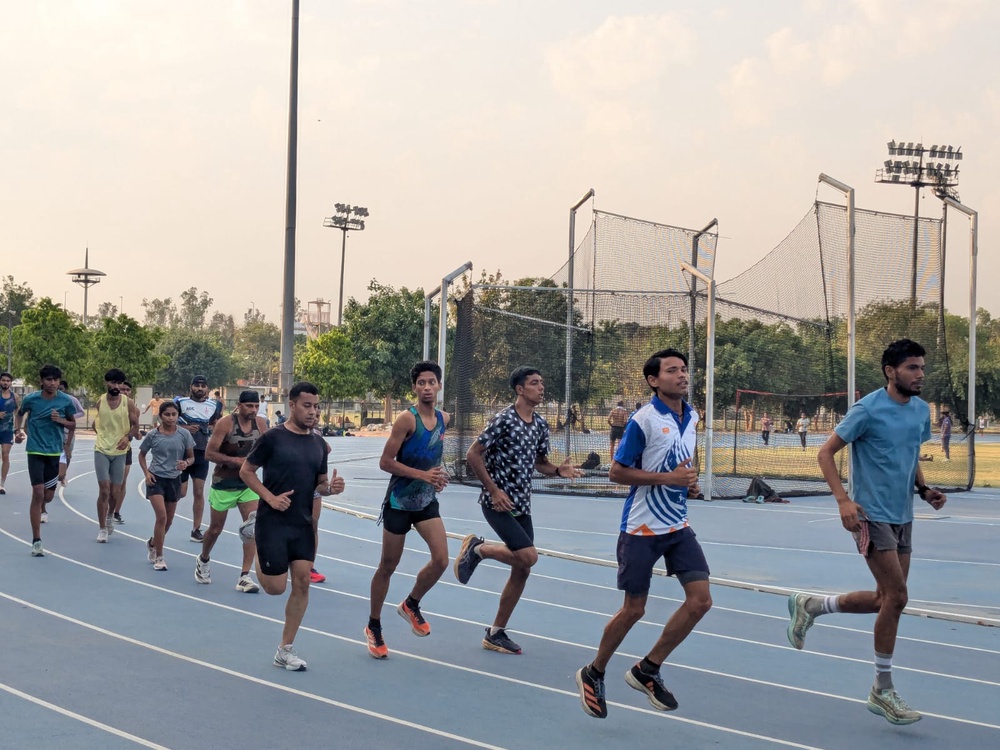 Athletes practicing in Delhi's Jawaharlal Nehru Stadium (Namita Singh/The Independent)