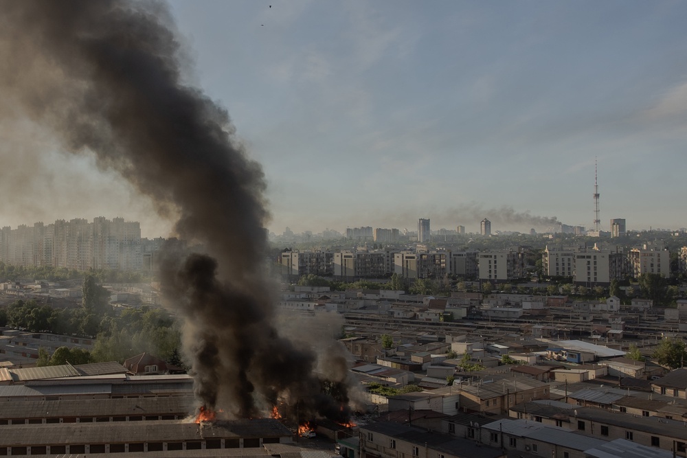 Smoke rises from different places damaged during a Russian missile and drone strikes in Kyiv (AFP/Getty)