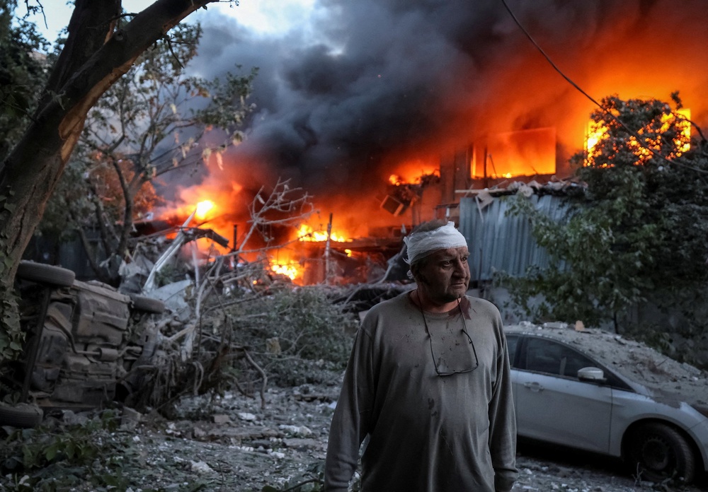 A resident stands at a site of a Russian drone and missile strike in Kyiv, Ukraine June 2 (Reuters)
