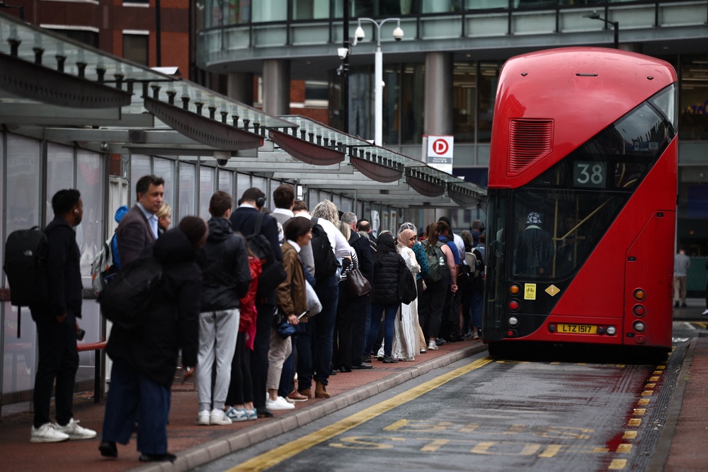 A long queue for the bus as several Tube lines are suspended or delayed (AFP/Getty)