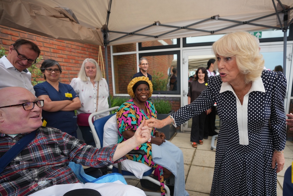 Camilla greets staff and patients as she opens the new roof garden (Kin Cheung/PA) (PA Wire)