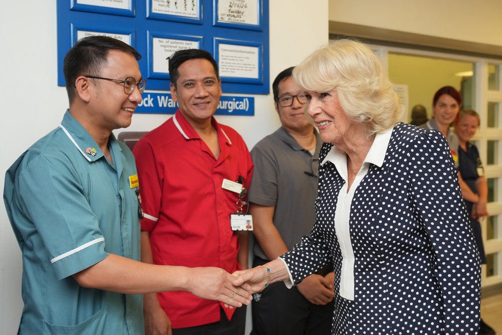 Camilla meets members of staff at the official opening of the new roof garden (Kin Cheung/PA) (PA Wire)