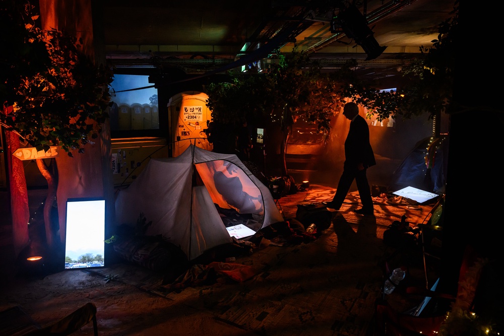 The installation provides a timeline of the horrific events that unfolded that day, amid actual staging, vehicles, and discarded personal items from the festival site (Getty)