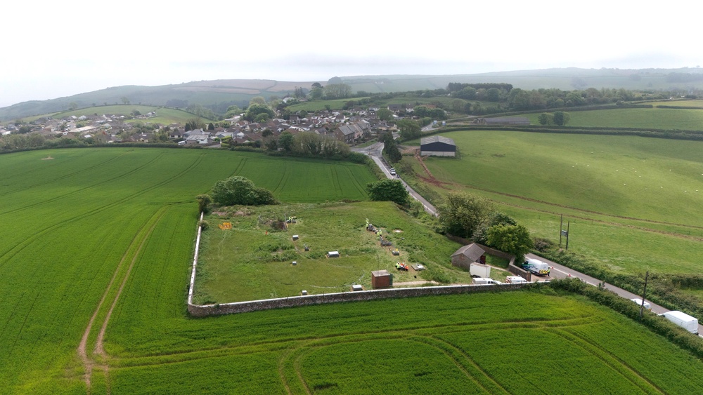 A drone view of workers at Hill Head reservoir in Devon (PA) (PA Archive)