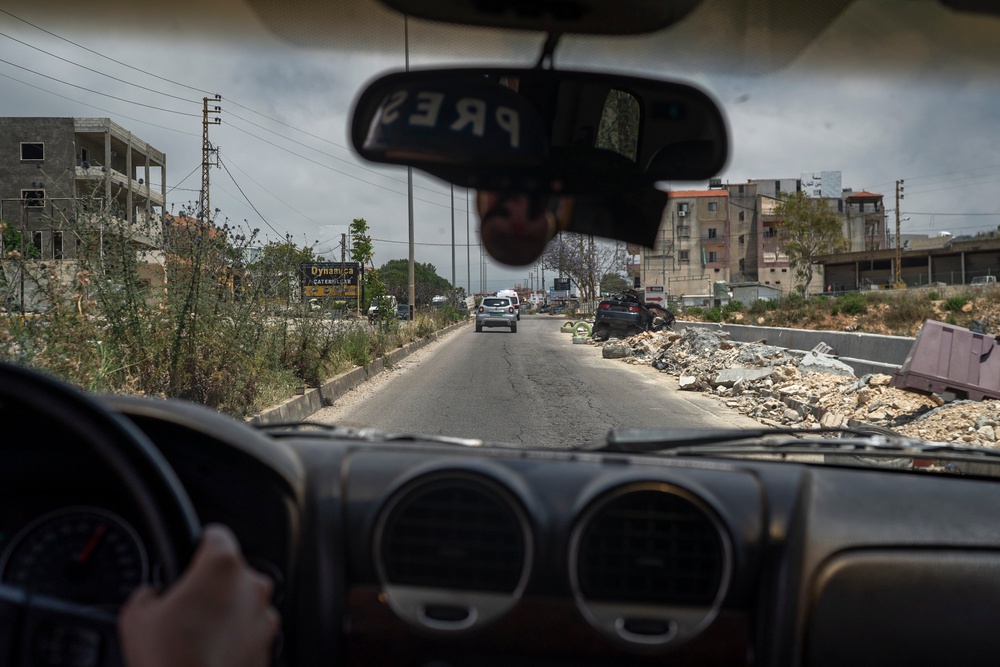 A car destroyed on the road, seen from inside another vehicle, on June 2, 2026 in Nabatieh, Lebanon (Getty)