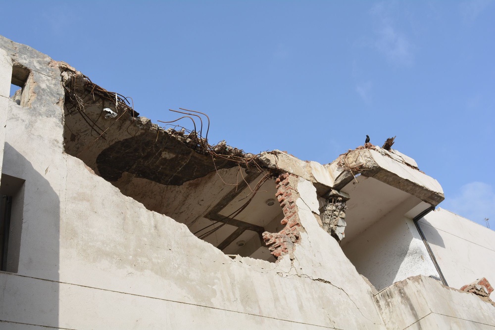 The tail of the crashed Air India plane is lodged in a hostel building of BJ Medical College in Ahmedabad on 12 June 2025 (Namita Singh/The Independent)
