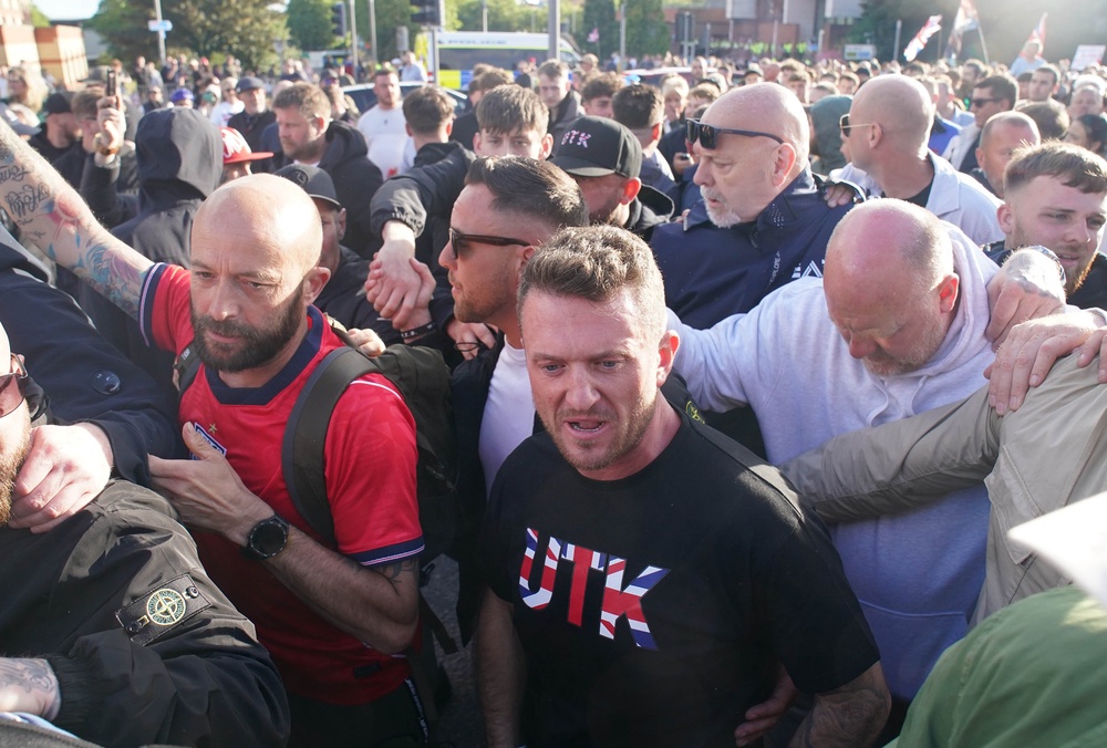 Tommy Robinson with protesters outside Southampton police station (Gareth Fuller/PA) (PA Wire)