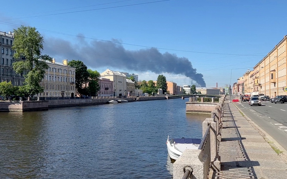 Heavy smoke billows after drones hit infrastructure in several districts of St. Petersburg (Reuters)