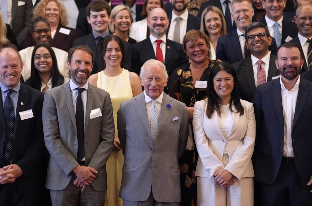 The King joined a group photo with all the attendees (Andrew Matthews/PA) (PA Wire)