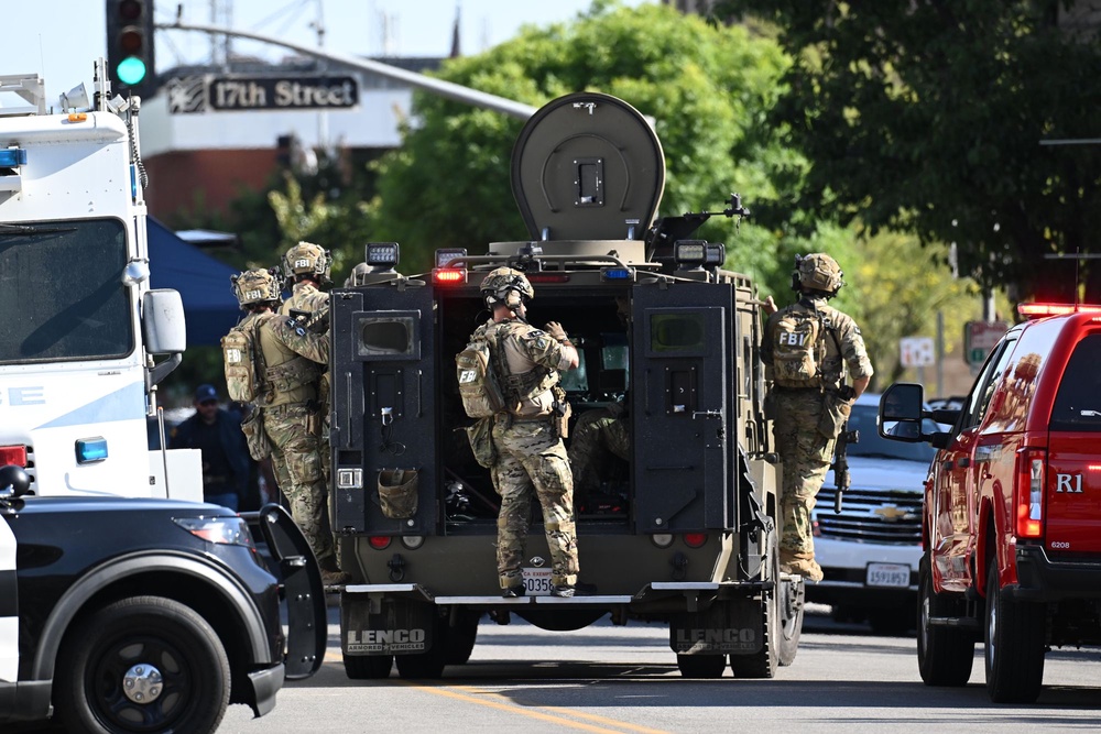 The hostage-take’s motive remains unclear although he spoke with police about his previous criminal cases (AP Photo/David Dennis)