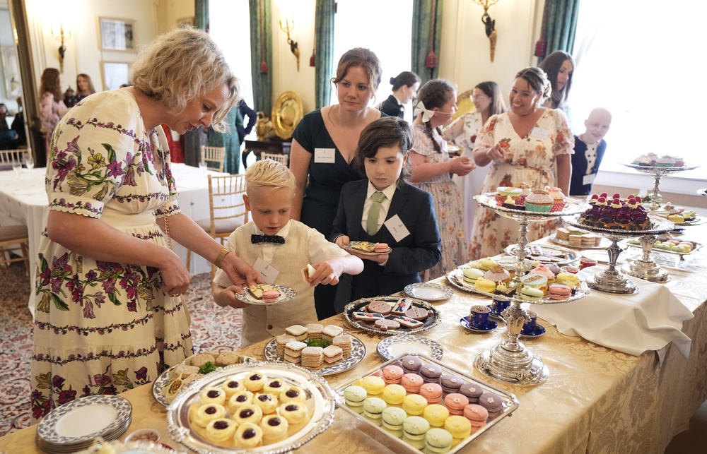 Children choose food during a tea party (Andrew Matthews/PA) (PA Wire)
