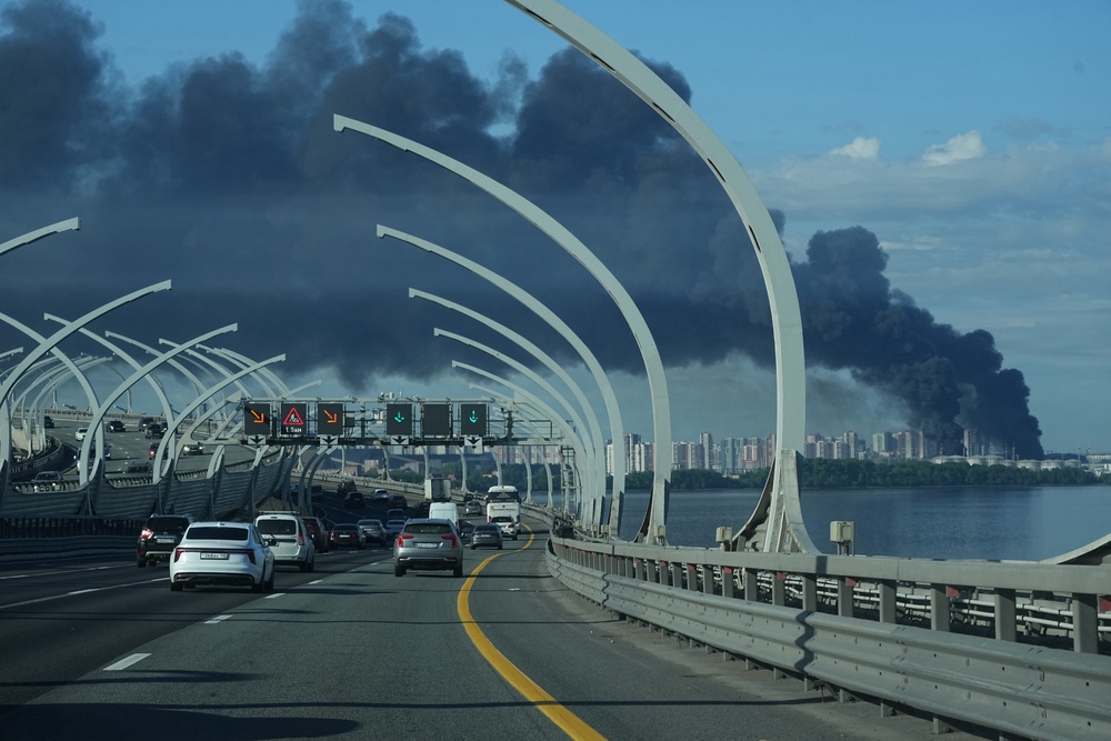A plume of black smoke is seen over the port of St Petersburg in Russia (AP)