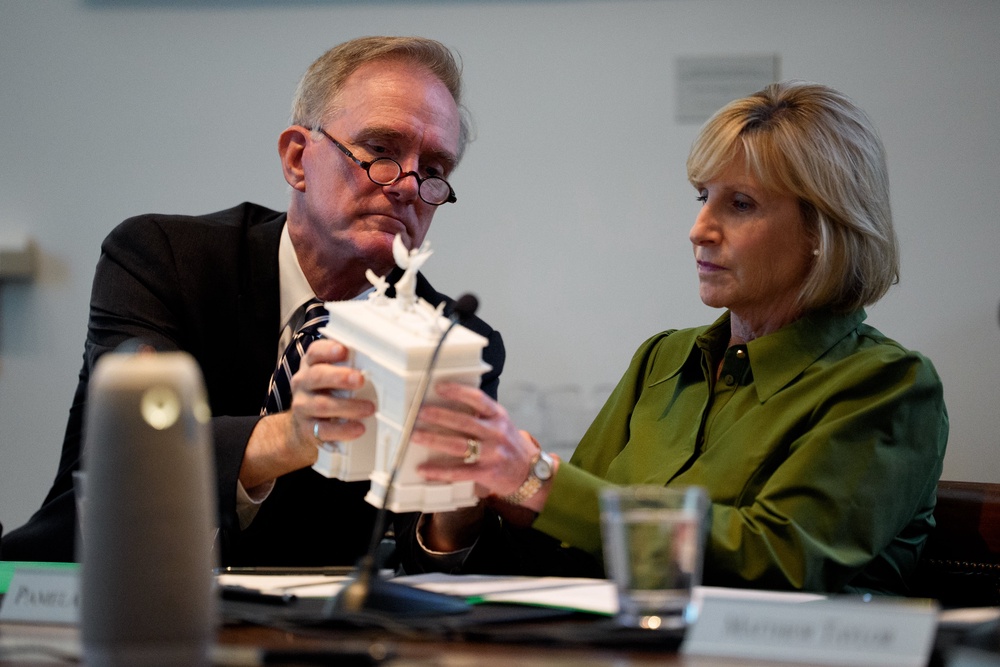 At least one lawmaker has raised concerns about the impact the arch could have on traffic. Pictured here, Commission of Fine Arts Chairman Rodney Mims Cook Jr., (L) hands Pamela Hughes Patenaude (R) a model of President Donald Trump's proposed triumphal arch on April 16 (Getty Images)