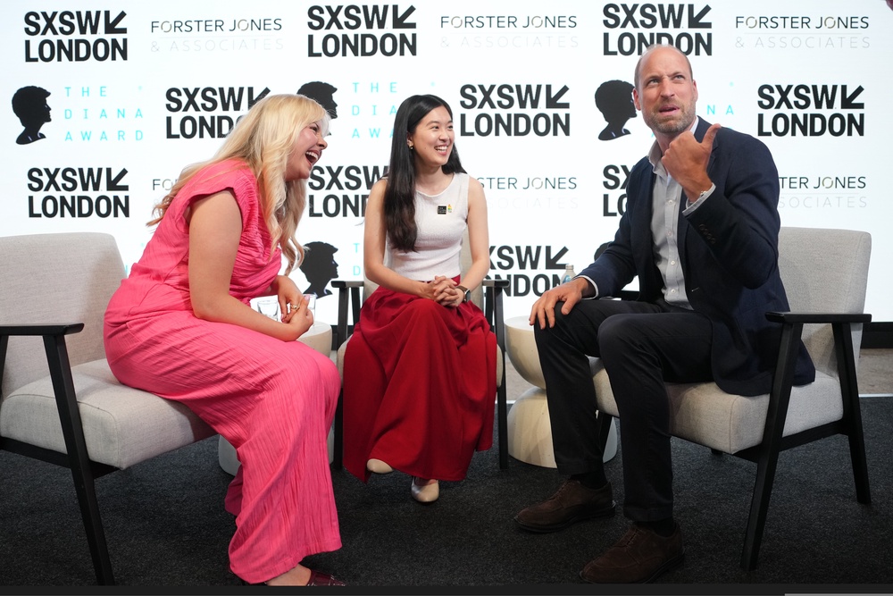 The Prince of Wales speaks to Sophie Pender, left, and Vivi Lin during a visit to the SXSW London Festival (Kin Cheung/PA) (PA Wire)