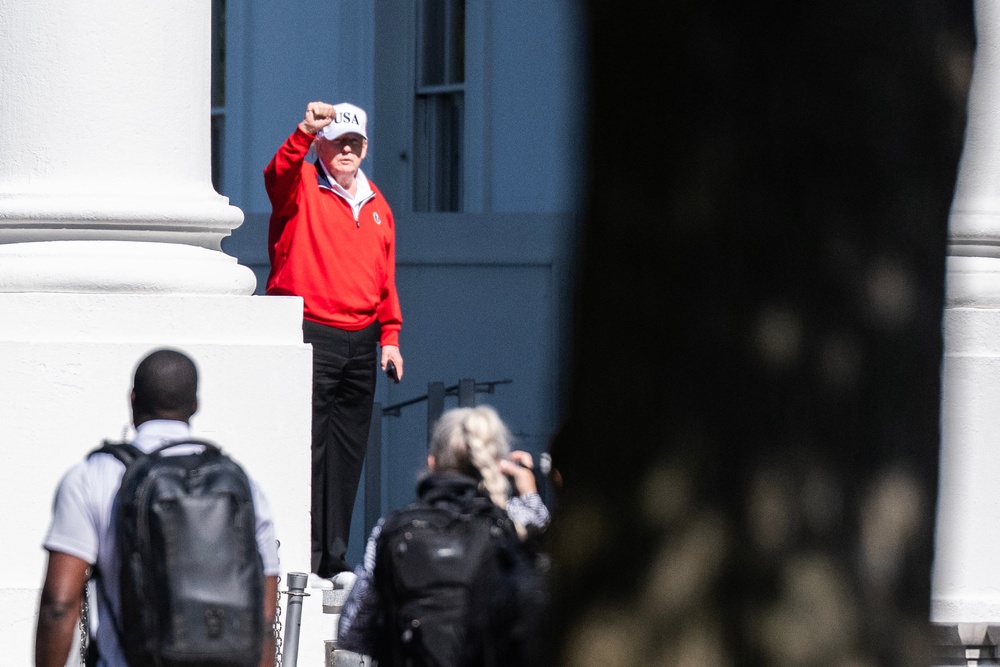 President Donald Trump waves as he returns to the White House after spending the day at Trump National Golf Club in Sterling, Virginia last weekend, after the  White House released a report that said his third physical in 11 months showed he is in 
