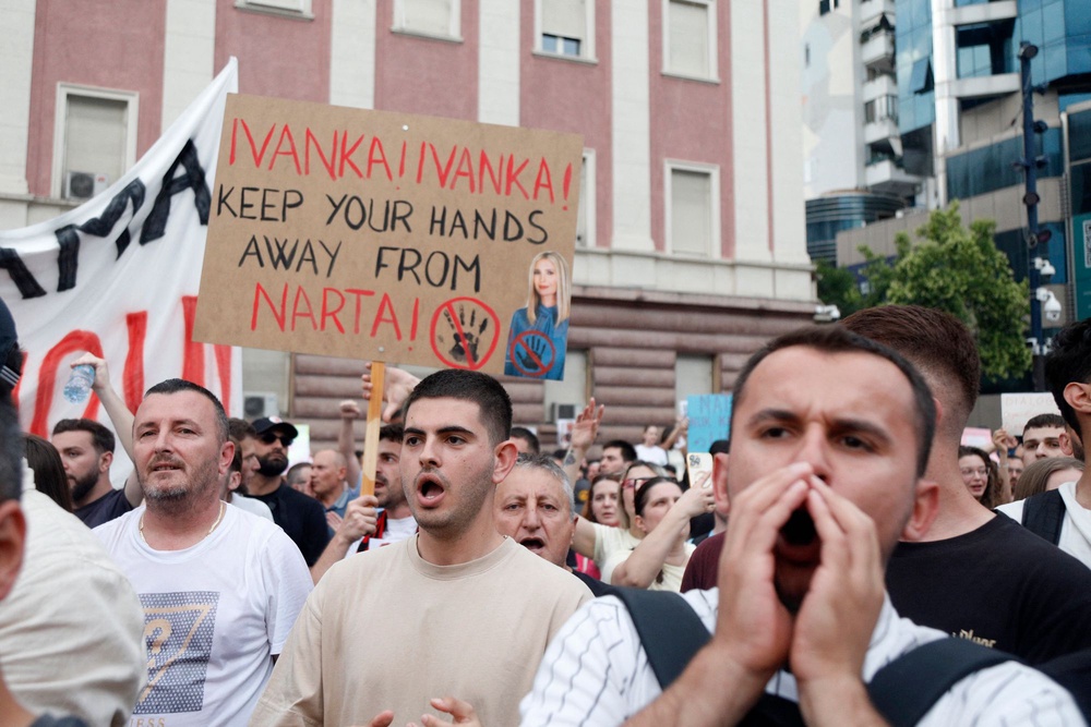 Protestors take part in a demonstration in front of the prime minister's office, against the construction of a luxury resort near a protected natural area, in Tirana on June 3, 2026 (AFP via Getty Images)