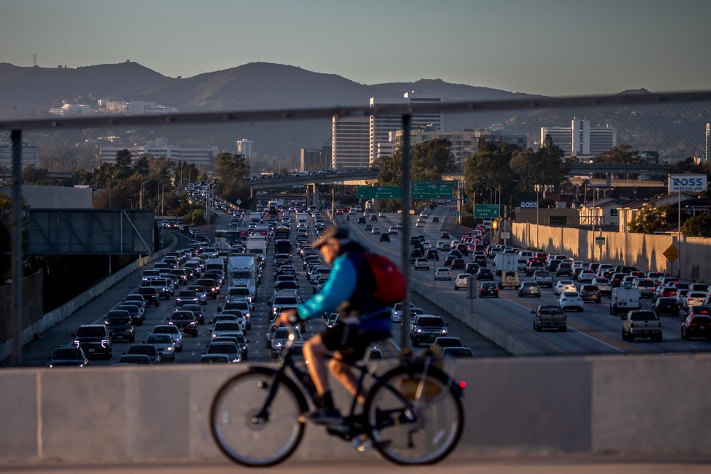 Exposure to PM2.5 particle pollution also raises the risk of cancer and cardiovascular disease. People can avoid exposure by exercising in areas away from busy roads (Getty Images)