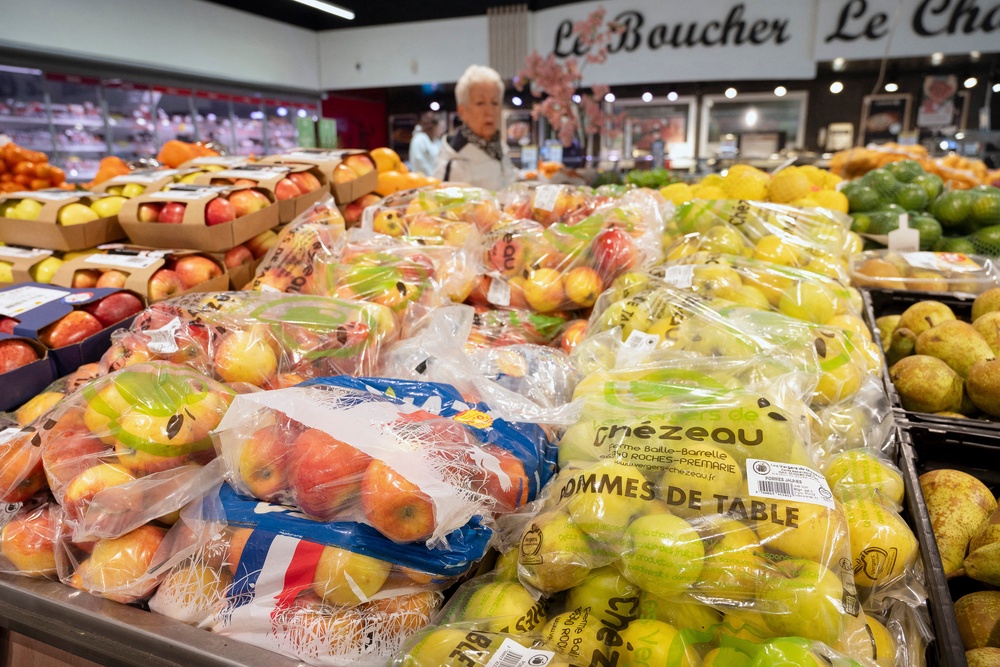 Apples packed in transparent plastic bags are displayed in the fruit and vegetable aisle (AFP/Getty)