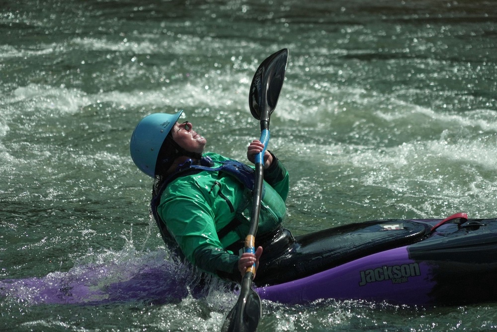 Hannah Ray J Childs kayaks at a whitewater park she helped create on the Maquoketa River Thursday, May 7, 2026, in Manchester, Iowa (AP Photo/Brittany Peterson)