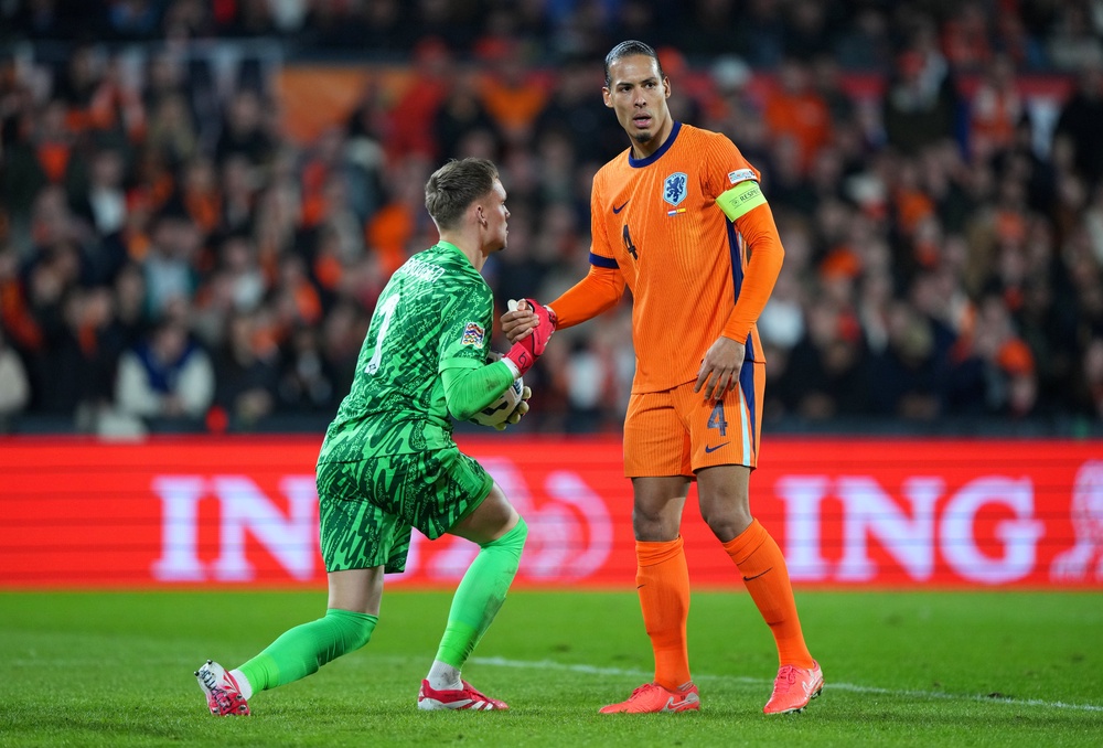 Bart Verbruggen and Virgil van Dijk in action during last year's Nations League (Getty)