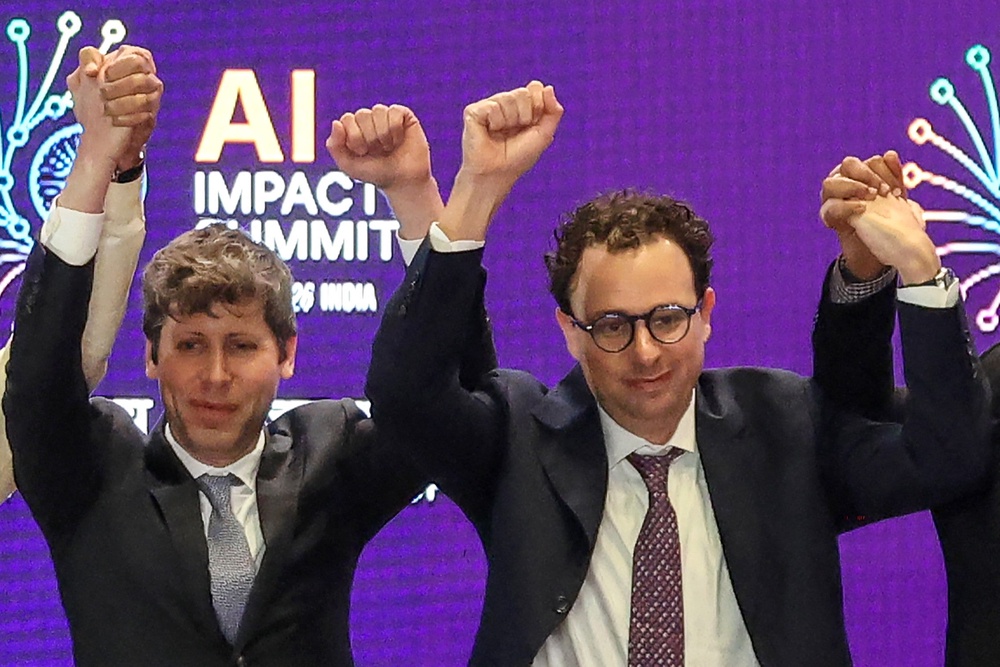 OpenAI CEO Sam Altman and Anthropic CEO Dario Amodei at the AI Impact Summit in New Delhi on 19 February, 2026 (AFP/Getty)