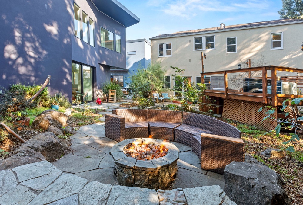 The stone fire pit in the shared courtyard at Radish. Because there are no real estate comps or Zestimates for a custom friend compound, the owners are bypassing the traditional market with a broad $4 million to $6 million target (Steph Dewey)