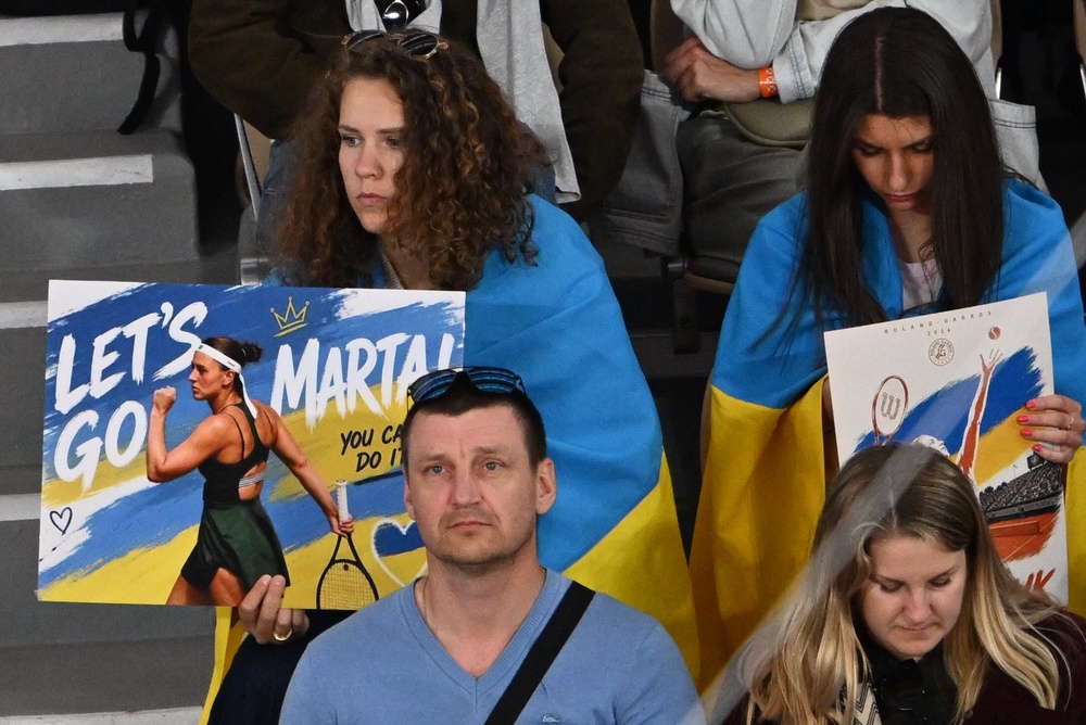 Fans supporting Ukraine’s Marta Kostyuk (Emma Da Silva/AP) (AP)