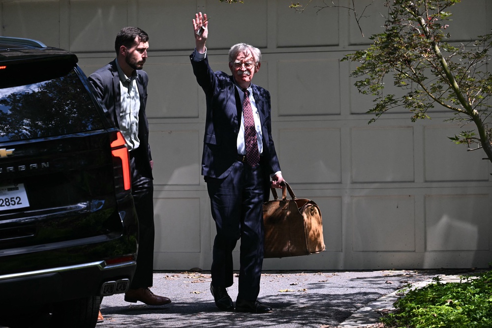Bolton pictured on the day federal agents searched his home in Bethesda as part of the investigation in August 2025 (AFP/Getty)