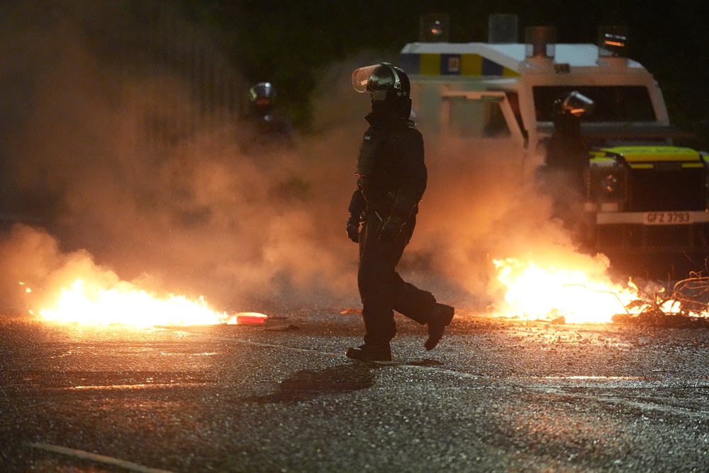 Police in Portadown after disorder in Ballymena in June last year (Brian Lawless/PA) (PA Archive)