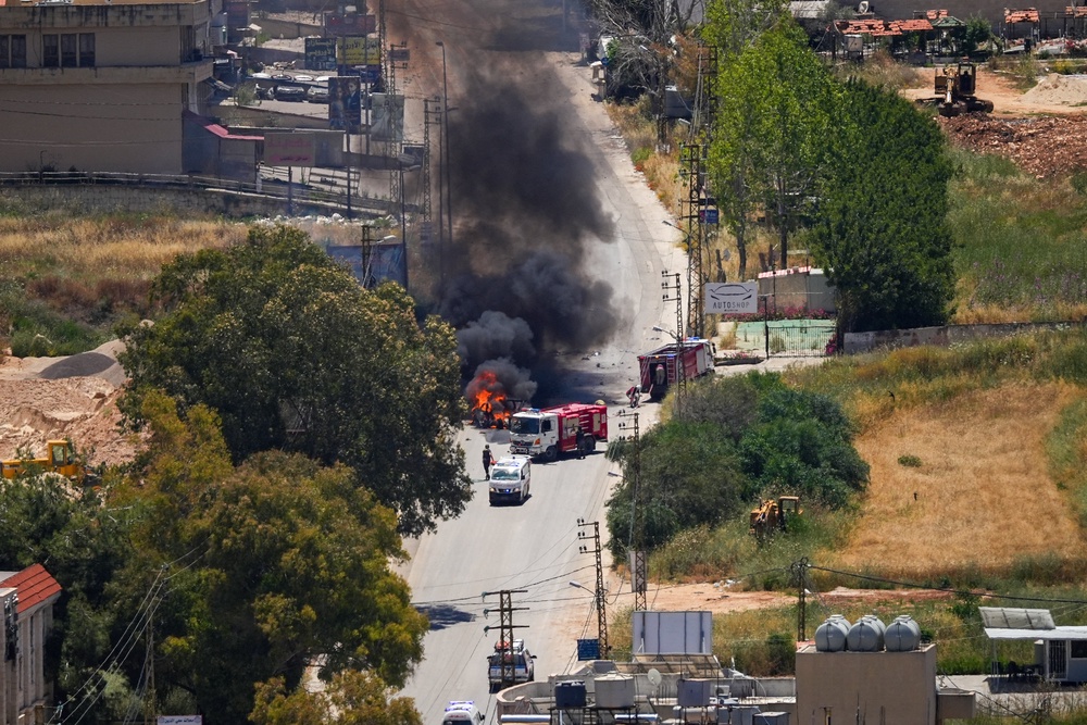 First responders attend to a burning vehicle targeted by an Israeli drone attack in the southern Lebanese city of Nabatieh on June 5, 2026. Israeli strikes overnight in the south Lebanon city of Tyre killed seven people, a source from Lebanon's civil defence told AFP on June 5, despite a ceasefire in the Israel-Hezbollah war. (AFP/Getty)