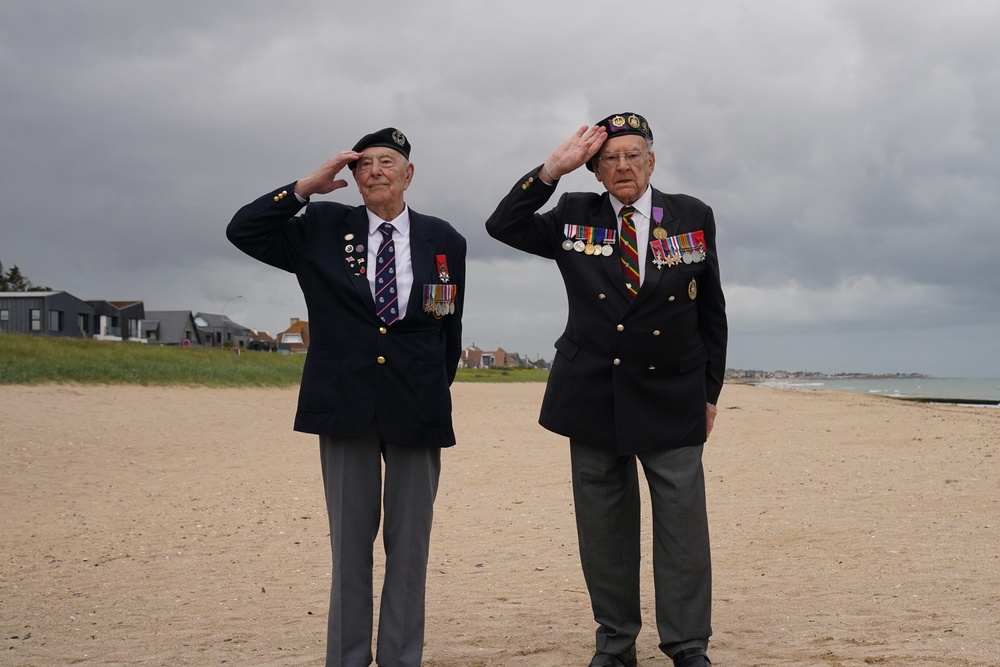 British veterans Ken Hay (right) and Henry Rice on Sword Beach, one of the Normandy D-Day landing beaches (PA Wire)