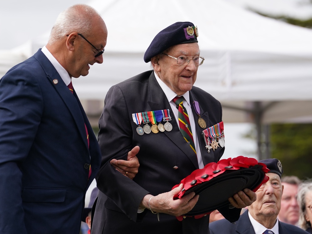 Ken Hay lays a poppy wreath at the Spirit of Normandy Trust service in Coleville-Montgomery (Gareth Fuller/PA) (PA Wire)