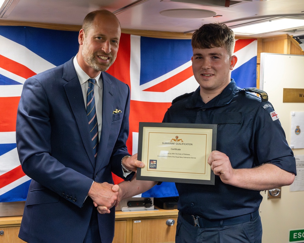 The Prince of Wales presented The Gold Submariner’s Dolphin, awarded to those completing the submarine qualifying course (LPhot Henry Parks/MOD/PA)