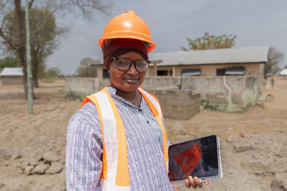 Fatima, a technician engineer, supervising the start of some construction work, at the Atampiisi community health centre, in the Bongo district (Basile Ouedraogo/WaterAid)