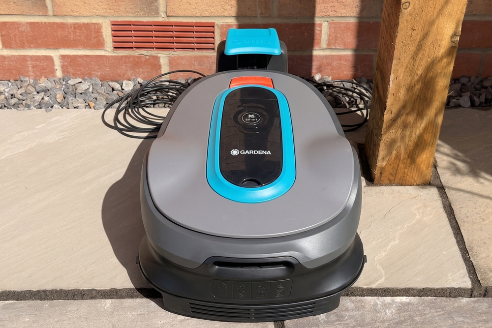 Most robot mowers charge on a dock (Connor Jewiss/The Independent)