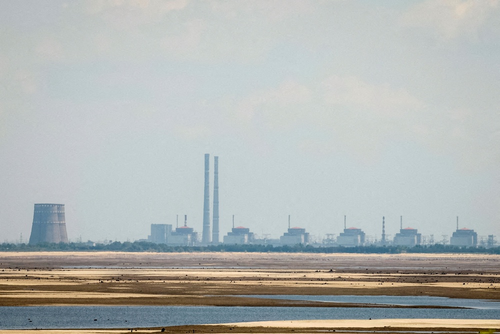 A view shows Zaporizhzhia Nuclear Power Plant from the bank of Kakhovka Reservoir near the town of Nikopol after the Nova Kakhovka dam breached, amid Russia's attack on Ukraine, in Dnipropetrovsk region, Ukraine 16 June 2023 (Reuters)