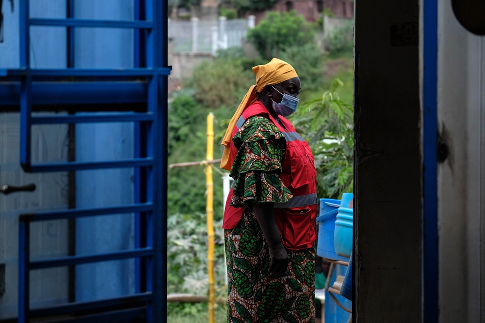 A health worker walks at a temporary health clinic at the Mpondwe border crossing linking Uganda and the Democratic Republic of the Congo, Thursday, June 4, 2026. (AP Photo/Hajarah Nalwadda) (Copyright 2026 The Associated Press. All rights reserved)