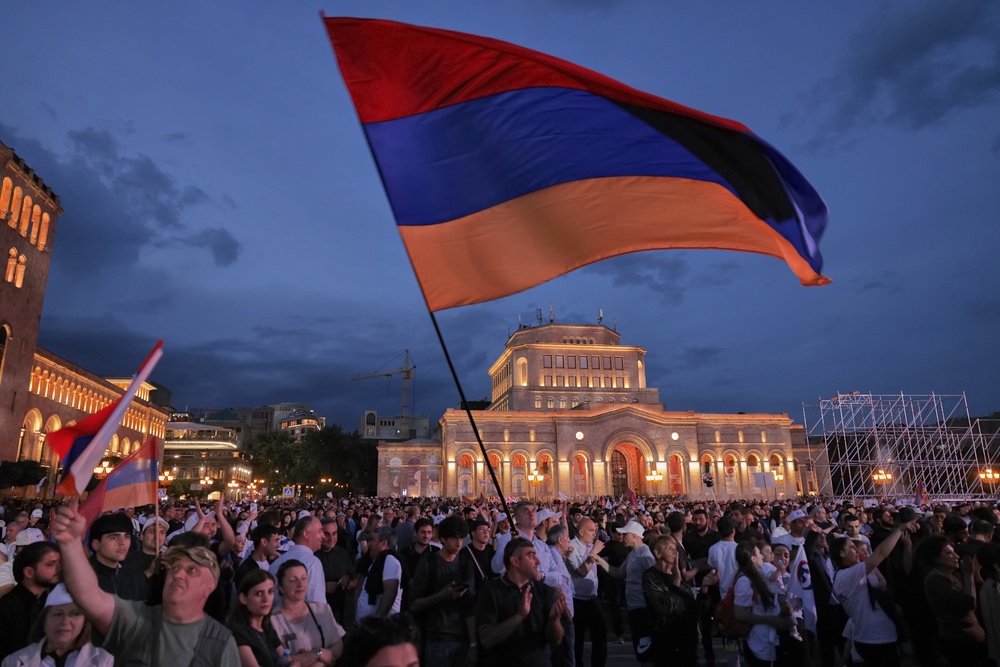 Supporters of Russian-Armenian tycoon Samvel Karapetyan, wave a Armenian national flag during a rally against incumbent Prime Minister Nikol Pashinyan at Republic Square in Yerevan, Armenia, Wednesday, 3 June 2026 (AP)