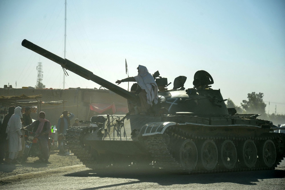 Taliban security personnel on a Soviet-era tank ride towards the border during clashes between Taliban security personnel and Pakistani border forces in 2025 (AFP/Getty)