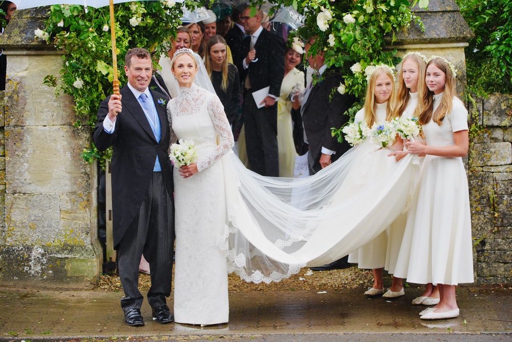 The happy couple, accompanied by bridesmaids (left to right) Isla Phillips, Savannah Phillips, and Georgina Sperling (PA)