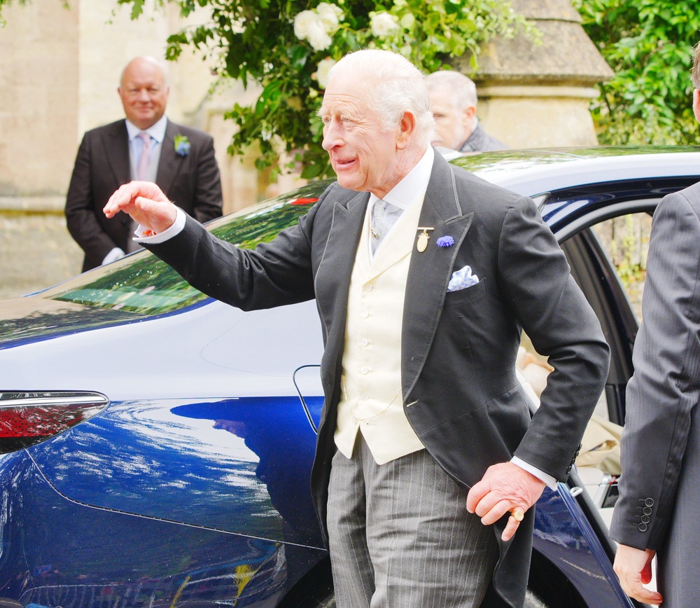 King Charles III arriving for the wedding of Harriet Sperling to Peter Phillips at All Saints Church in Kemble (PA)