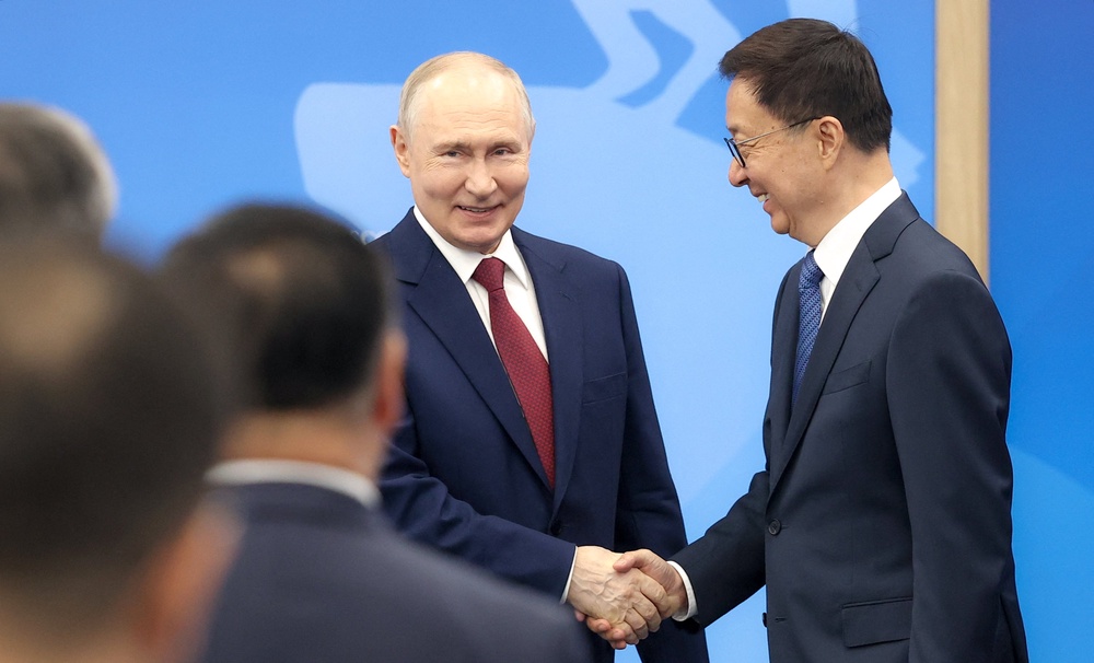 Russia's president Vladimir Putin and Vice President of the People's Republic of China Han Zheng hold a meeting on the sidelines of the St Petersburg International Economic Forum (AFP/Getty)